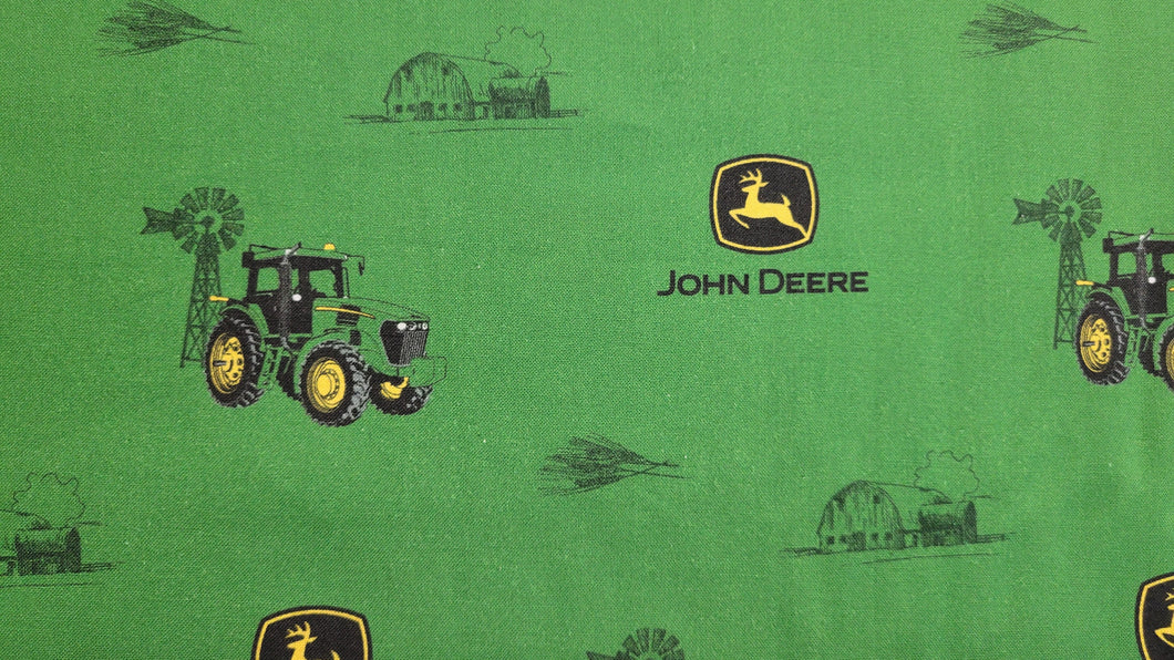 John Deere Logo and tractor on a green background
